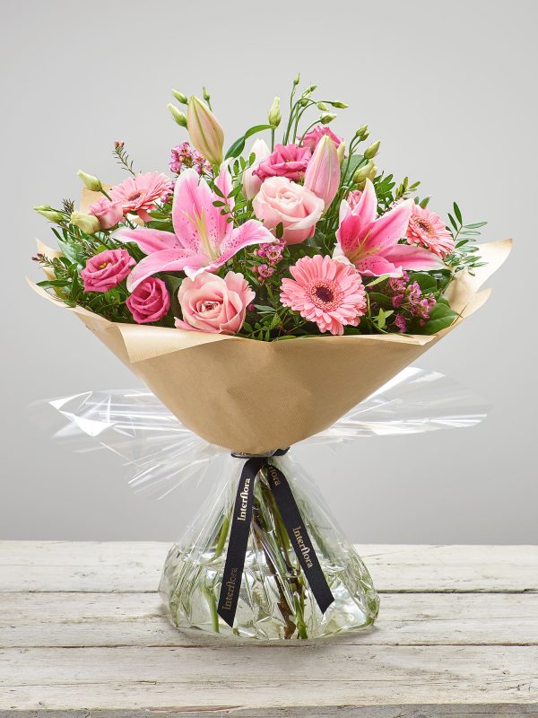 ‘Pink Radiance’ - Hand-tied fresh flower bouquet with oriental pink lilies, pink large-headed roses, pink germinis, pink lisianthus and pink waxflower. (Code: C00350PS)